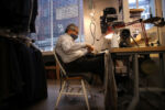 Boston, MA - 10/13/2020: Master Tailor Salvatore Garofalo works at ARI Boston. The mens shop has been in business for nearly a quarter century, opening first in Liberty Square and now in a bigger space around the corner on Broad Street. ItÕs the ideal locale for a luxury menswear shop, which depends on the expensive tastes of the well-paid executives who work Ñ or rather, worked Ñ in the office towers nearby.
Owner Ari Gil and his wife, Desiree, closed the store in March, then reopened in June to find themselves stuck with spring merchandise they could not move. With revenues down about 70 percent, the couple has used savings to pay vendors.