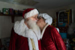 Dennis and Sheila share a kiss in the room of toys to donate after discussing the importance of giving back to their community in Rhode Island.