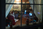 Santa Dennis holds a video visit with his great-grandson Jamison, 5, through a zoom call, which is relatively new to both Dennis and Sheila this year.