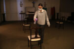 East Boston, MA - 4/29/20 - Apprentice funeral director Catie Ruggiero, sprays each chair down with lysol following a wake at Ruggiero Family Memorial Home as she prepared to turn the room over for the next funeral service.