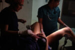 From 2015-2016 alone Venezuela saw a 65% increase in maternal mortality according to Amnesty International. Then again in 2018 Venezuela saw another 65% increase in maternal mortality over the previous year according to a report from the University of Miami. The main causes, a lack of medicine and a lack of doctors. Dr. Luisangela Correa is an Emergency General Surgeon that supports Ob/Gyn in the Concepción Palacios Maternity Hospital in Caracas, Venezuela. For 19 years she has been working in the ob/gyn public hospital sector of Caracas. The public hospital sector of Caracas used to be reliable and dependable, a high quality system. Dr. Correa spends her days fighting for woman to have a place to give birth and receive gynecological care. In the last year alone Dr. Correa has seen her number of colleagues drop to less than half. Many have left the country due to the ongoing political crisis. What was once 6 surgeons is now 2. She is currently working without pay. She tells me, “If I don’t do this job, no one will. Here, there is no one left.”
Ronald, trained by Dr. Correa, places a baby on a woman who gave birth naturally with no supplies. Luckily she had no complications.