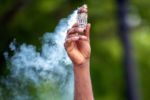 A protester burns sage at a May 29, 2020 protest at Peter's Park in Boston's South End.