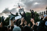Protesters yell "Hands up. Don't Shoot," at a Black Lives Matter protest outside the Massachusetts Statehouse on May 31, 2020.