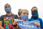A child holds an Ed Markey sign at a campaign event in Marshfield, Massachusetts on Aug. 15, 2020.