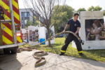 Boston Fire Department Engine 42 firefighters assist the Boston Press Photographers Association during the installation of the 2020 Pictures of the Year exhibition in Justice Edward O. Gourdin Veterans Memorial Park in Boston, Massachusetts, on Mon., June 7, 2021. The firefighters filled water barrels inside the cubes to weigh them down in case of wind. The ten 6-foot cubes featuring Pictures of the Year winning images had been displayed in Copley Square for the previous two weeks and will now be on view in Nubian Square for the next two weeks. The exhibition was made in partnership with GBH and Photoville with graphic design by Gene Yoon. Boston Fire Department Engine 42 firefighters assist the Boston Press Photographers Association during the installation of the 2020 Pictures of the Year exhibition in Justice Edward O. Gourdin Veterans Memorial Park in Boston, Massachusetts, on Mon., June 7, 2021. The firefighters filled water barrels inside the cubes to weigh them down in case of wind. The ten 6-foot cubes featuring Pictures of the Year winning images had been displayed in Copley Square for the previous two weeks and will now be on view in Nubian Square for the next two weeks. The exhibition was made in partnership with GBH and Photoville with graphic design by Gene Yoon.