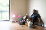 Jean Ronald Pinthievre sits with his daughter, Lovemica, in their Marlborough, MA apartment on August 7, 2024. Pinthievre's wife, Lovely, works at the Meadowbrook location of Thrive in Shrewsbury, MA. Lovely and her family arrived in the United States in 2023.